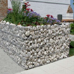 flower beds made of stones with their own decor photo