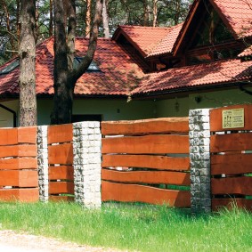 wooden fence made of stone and boards