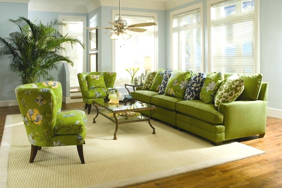 Decorative pillows on a green sofa in the hall