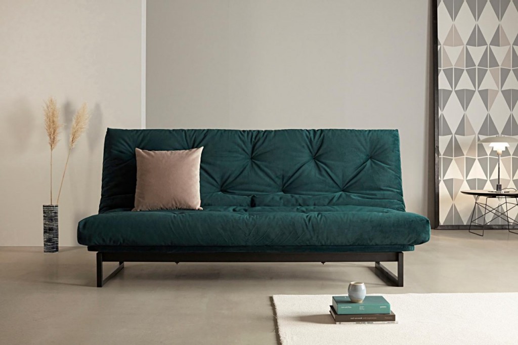 Dark green thin-legged sofa