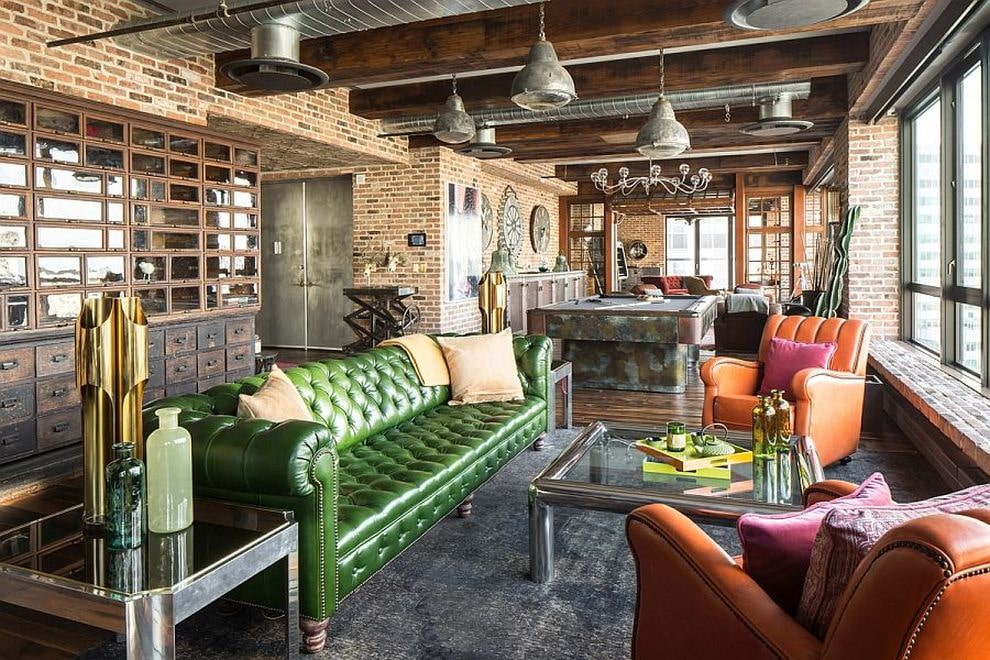 Green sofa sa loft interior
