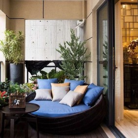 Comfortable sofa on the loggia in the apartment
