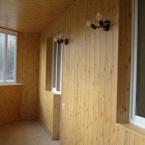 Covering the walls of the balcony with a wooden lining