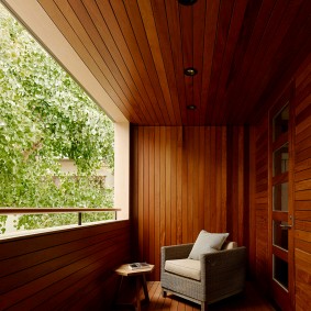 Wooden panels in the interior design of the balcony