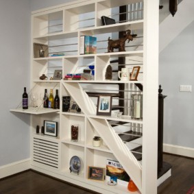 White bookcase with a small bar