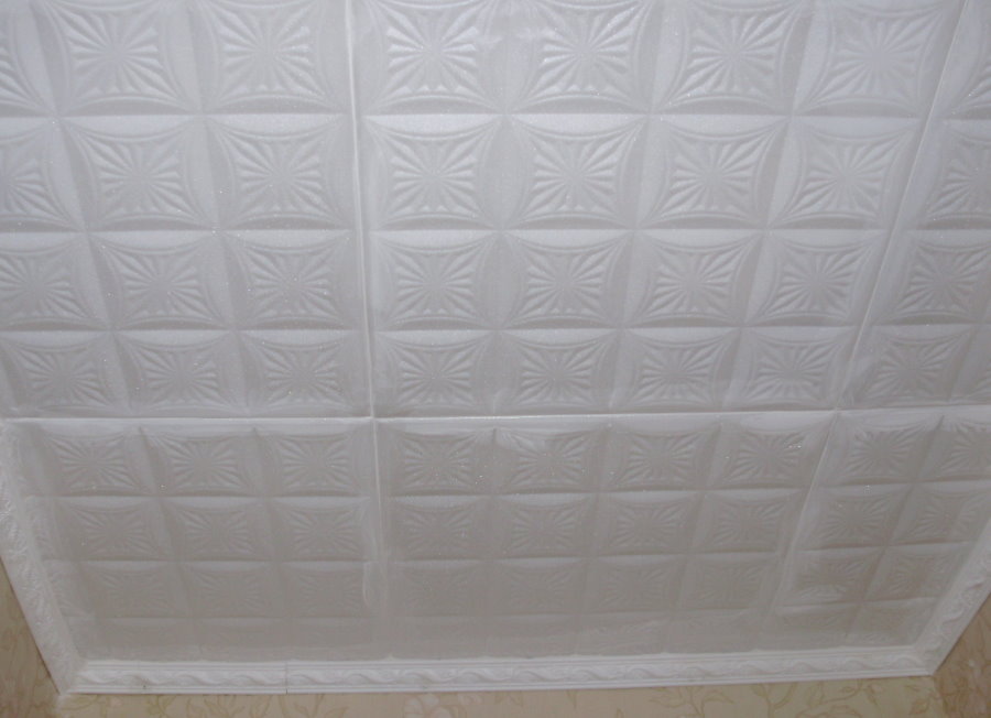 White polystyrene tiles with texture on the ceiling of the balcony
