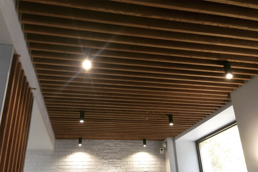 Thin slats on the ceiling of a glazed loggia