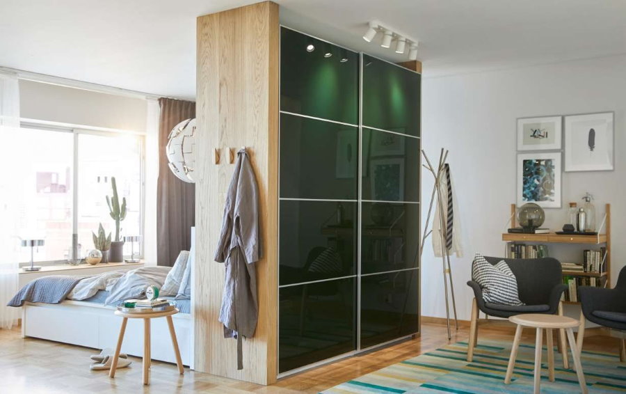 Sliding wardrobe between a bedroom and a living room