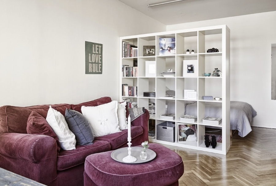 White shelving instead of a partition in a studio apartment