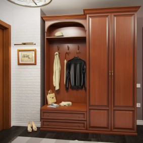 wardrobe with hinged doors to the entrance